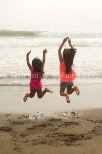 Fair Trade Photo 10-15 years, 5 -10 years, Activity, Beach, Children, Colour image, Day, Emotions, Friendship, Happiness, Holiday, Jumping, Ocean, People, Peru, Playing, Sand, Sea, Seasons, Sister, South America, Summer, Two, Vertical, Water