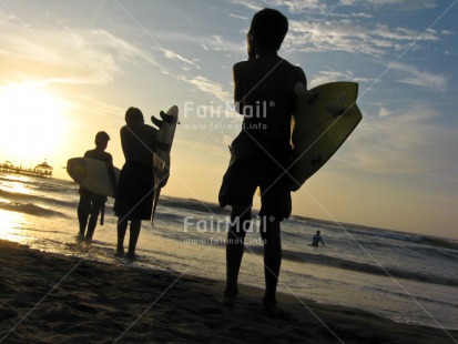 Fair Trade Photo 15-20 years, Beach, Colour image, Evening, Friendship, Group of boys, Horizontal, Outdoor, People, Peru, Sand, Sea, South America, Sport, Surfboard