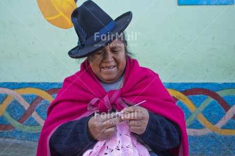 Fair Trade Photo Activity, Clothing, Colour image, Crafts, Ethnic-folklore, Horizontal, Knitting, Latin, Looking away, One woman, People, Peru, Pink, Portrait halfbody, Rural, Smiling, South America, Traditional clothing, Wool