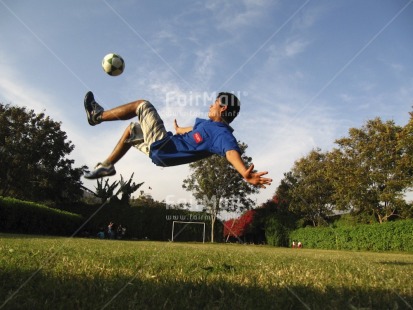 Fair Trade Photo Activity, Ball, Colour image, Horizontal, Kicking, Latin, One boy, Outdoor, People, Peru, Playing, Portrait fullbody, Soccer, South America, Sport