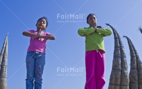 Fair Trade Photo 10-15 years, Activity, Casual clothing, Clothing, Colour image, Day, Green, Horizontal, Latin, Looking at camera, Outdoor, People, Peru, Pink, Sky, Smiling, South America, Two girls, Yoga