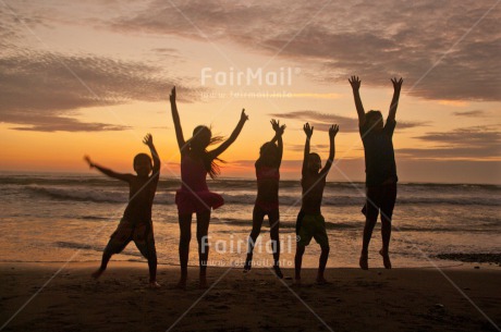 Fair Trade Photo Activity, Beach, Colour image, Cooperation, Emotions, Friendship, Group of children, Happiness, Horizontal, Jumping, Outdoor, People, Peru, Playing, Sea, Shooting style, Silhouette, South America, Summer, Together