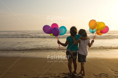 Fair Trade Photo Activity, Balloon, Beach, Birthday, Celebrating, Child, Colour image, Day, Emotions, Friendship, Girl, Happiness, Holding, Holiday, Horizontal, Multi-coloured, Ocean, Outdoor, People, Peru, Sand, Sea, Seasons, Sister, South America, Standing, Summer, Water