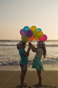 Fair Trade Photo Activity, Balloon, Beach, Birthday, Celebrating, Child, Colour image, Day, Emotions, Friendship, Gift, Girl, Happiness, Holding, Holiday, Multi-coloured, Ocean, Outdoor, People, Peru, Sand, Sea, Seasons, Sister, South America, Standing, Summer, Vertical, Water