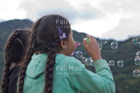 Fair Trade Photo Activity, Colour image, Dailylife, Emotions, Friendship, Happiness, Horizontal, Outdoor, People, Peru, Playing, Soapbubble, South America, Summer, Together, Two girls