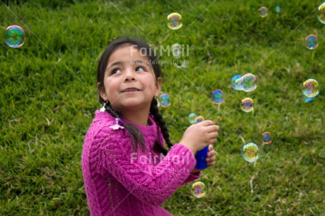 Fair Trade Photo Activity, Colour image, Dailylife, Emotions, Happiness, Horizontal, One girl, Outdoor, People, Peru, Playing, Soapbubble, South America, Summer