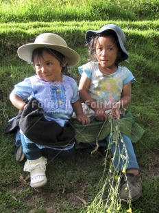 Fair Trade Photo Activity, Blue, Colour image, Cute, Dailylife, Friendship, Green, Looking at camera, Multi-coloured, Nature, Outdoor, People, Peru, Portrait fullbody, Sitting, South America, Together, Two children, Two girls, Vertical