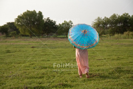 Fair Trade Photo Activity, Blue, Colour image, Emotions, Grass, Green, Holiday, Horizontal, Loneliness, One woman, People, Peru, Rural, South America, Travel, Umbrella, Walking