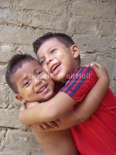 Fair Trade Photo 5-10 years, Activity, Casual clothing, Clothing, Colour image, Day, Family, Friendship, Horizontal, Hug, Hugging, Looking at camera, Love, Multi-coloured, Outdoor, People, Peru, Portrait halfbody, Smile, Smiling, South America, Street, Streetlife, Together, Two boys, Two children, Vertical