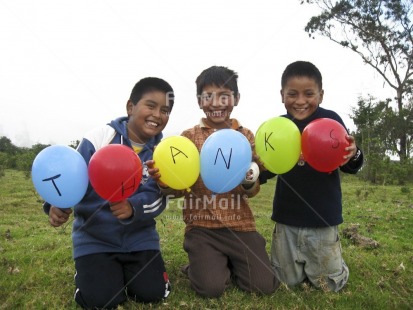 Fair Trade Photo 10-15 years, Balloon, Casual clothing, Clothing, Colour image, Day, Friendship, Horizontal, Latin, Letter, Multi-coloured, Outdoor, People, Peru, Rural, Smiling, South America, Thank you