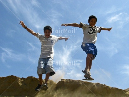 Fair Trade Photo Activity, Casual clothing, Clothing, Colour image, Emotions, Friendship, Happiness, Horizontal, Jumping, Low angle view, People, Peru, Playing, Screaming, Seasons, Sky, South America, Summer, Two boys