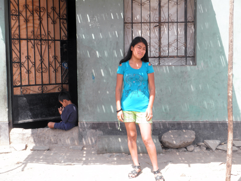Patricia in front of her mother's house. Patricia in front of her mother's house.