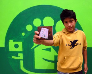 FairMail Peru photographer Sebastian showing his Ben & Jerry Christmas card