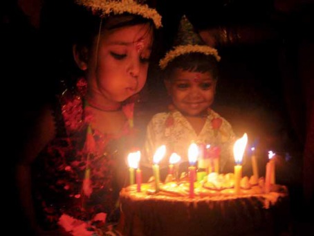 Fair Trade Photo Greeting Card 5_-10_years, Activity, Asia, Asian, Birthday, Blowing, Cake, Candle, Colour image, Congratulations, Emotions, Family, Flame, Happiness, Horizontal, India, Indoor, Night, Party, People, Smiling, Two children