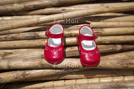 Fair Trade Photo Bamboo, Birth, Closeup, Colour image, Girl, Horizontal, New baby, People, Peru, Red, Shoe, Shooting style, South America