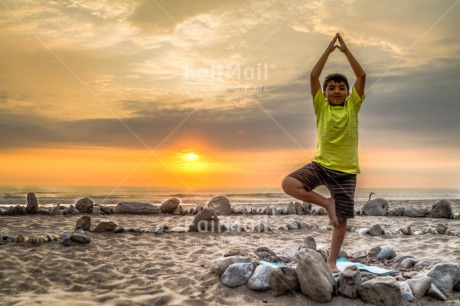 Fair Trade Photo Balance, Beach, Colour image, Horizontal, One boy, Peace, People, Sea, Spirituality, Stone, Wellness, Yoga