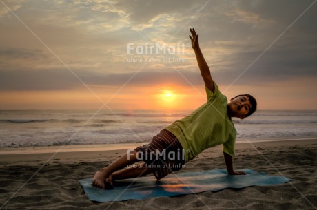 Fair Trade Photo Beach, Colour image, Horizontal, One boy, Peace, People, Sea, Spirituality, Sunset, Wellness, Yoga