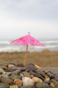 Fair Trade Photo Beach, Colour image, Day, Holiday, Ocean, Outdoor, Peru, Pink, Relax, Sea, Sky, South America, Stone, Umbrella, Vertical, Water