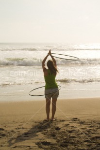 Fair Trade Photo 20-25 years, Activity, Balance, Beach, Circle, Colour image, Girl, Ocean, People, Peru, Playing, Sand, Sea, South America, Vertical, Water, Woman