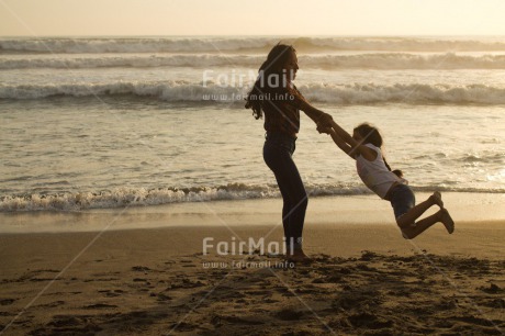 Fair Trade Photo 15-20 years, 5 -10 years, Activity, Beach, Children, Colour image, Dancing, Emotions, Evening, Friendship, Happiness, Holiday, Horizontal, Joy, Ocean, People, Peru, Playing, Sand, Sea, Seasons, Sister, South America, Summer, Sunset, Two, Water