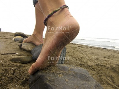 Fair Trade Photo Activity, Beach, Closeup, Colour image, Day, Foot, Horizontal, One girl, Outdoor, People, Peru, Sand, Sea, Seasons, South America, Stone, Summer, Walking