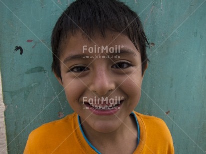 Fair Trade Photo 5 -10 years, Activity, Colour image, Day, Food and alimentation, Fruits, Horizontal, Latin, Looking at camera, One boy, One child, Orange, Outdoor, People, Peru, Portrait headshot, Smiling, South America, Street, Streetlife