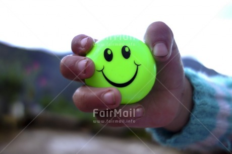 Fair Trade Photo 5 -10 years, Closeup, Colour image, Focus on foreground, Friendship, Green, Hand, Horizontal, One child, Peru, Smile, Smiling, South America