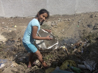 Fair Trade Photo Activity, Casual clothing, Child labour, Clothing, Colour image, Day, Garbage, Garbage belt, Horizontal, Looking at camera, One girl, Outdoor, People, Peru, Portrait fullbody, Recycle, Smiling, South America, Working