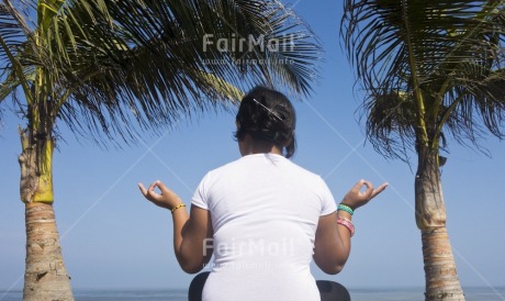 Fair Trade Photo 15-20 years, Activity, Casual clothing, Clothing, Colour image, Horizontal, Latin, Light, Meditating, One girl, Palmtree, People, Peru, Sitting, South America, Sun, Tree, Yoga