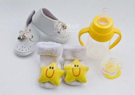 Fair Trade Photo Birth, Closeup, Colour image, Horizontal, New baby, Peru, Shoe, Smile, South America, Star, Studio, White, Yellow