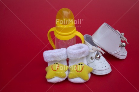 Fair Trade Photo Birth, Closeup, Colour image, Horizontal, Indoor, New baby, Peru, Shoe, South America, Star, Studio, White, Yellow