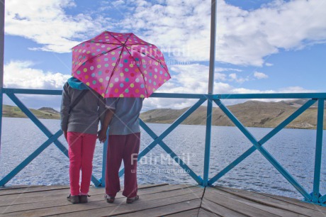 Fair Trade Photo Activity, Colour image, Day, Friendship, Horizontal, Outdoor, People, Peru, Rural, South America, Together, Two girls, Umbrella, Walking
