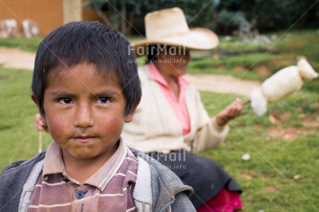 Fair Trade Photo Activity, Agriculture, Clothing, Colour image, Day, Horizontal, Latin, Looking away, One boy, One woman, Outdoor, People, Peru, Portrait headshot, Rural, Sombrero, South America, Traditional clothing, Wool