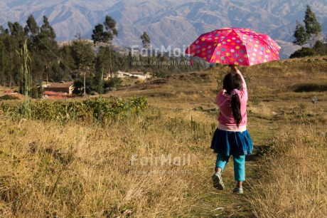 Fair Trade Photo 5 -10 years, Activity, Colour image, Emotions, Happiness, Horizontal, Latin, One girl, People, Peru, Pink, South America, Travel, Umbrella, Walking