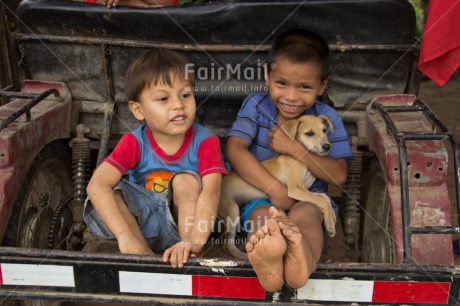 Fair Trade Photo Activity, Animals, Casual clothing, Clothing, Colour image, Dog, Friendship, Horizontal, Latin, People, Playing, Rural, Smiling, Streetlife, Two boys