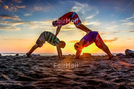 Fair Trade Photo Beach, Colour image, Evening, Group of boys, Horizontal, Peace, People, Sea, Spirituality, Summer, Sunset, Wellness, Yoga