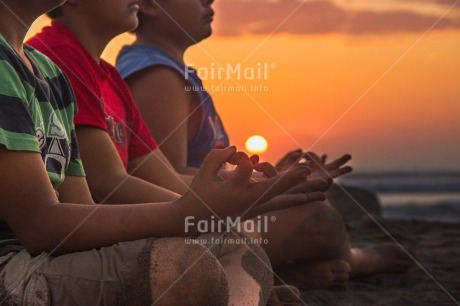 Fair Trade Photo Activity, Beach, Colour image, Evening, Group of boys, Horizontal, Meditating, Peace, People, Sea, Spirituality, Summer, Sunset, Wellness, Yoga