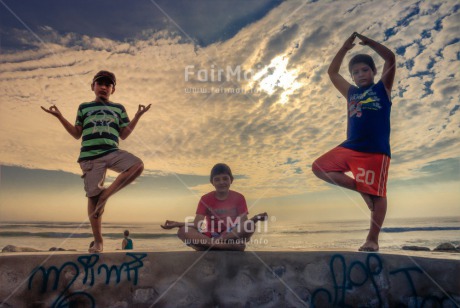 Fair Trade Photo Beach, Colour image, Evening, Group of boys, Horizontal, Peace, People, Sea, Spirituality, Summer, Sunset, Wellness, Yoga