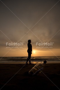 Fair Trade Photo Activity, Barefeet, Beach, Bottle, Coastal, Colour image, Emotions, Evening, Footstep, Huanchaco, Loneliness, Message, Ocean, Outdoor, People, Peru, Sea, Shooting style, Silhouette, South America, Sunset, Vertical, Walking, Water
