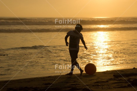 Fair Trade Photo Activity, Ball, Beach, Boy, Colour image, Horizontal, Ocean, Outdoor, People, Peru, Playing, Sea, Shooting style, Silhouette, Soccer, South America, Sunset, Water