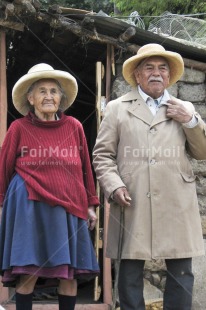Fair Trade Photo 75-80 years, Activity, Clothing, Colour image, Day, Grandfather, Grandmother, Hat, Latin, Looking away, Old age, One man, One woman, Outdoor, People, Peru, Portrait fullbody, Rural, Sombrero, South America, Standing, Traditional clothing, Vertical