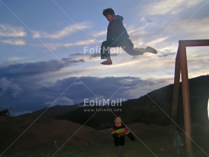 Fair Trade Photo Activity, Colour image, Good luck, Horizontal, Jumping, Nature, One boy, Outdoor, People, Peru, Playing, Scenic, Sky, South America, Strength, Two children