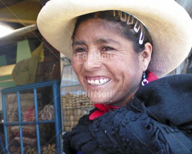 Fair Trade Photo 35-40 years, Activity, Clothing, Colour image, Dailylife, Hat, Horizontal, Latin, Looking away, Multi-coloured, One woman, Outdoor, People, Peru, Portrait headshot, Rural, Smile, Smiling, Sombrero, South America, Streetlife, Traditional clothing