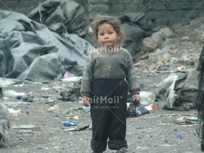 Fair Trade Photo Activity, Casual clothing, Child labour, Clothing, Colour image, Day, Garbage, Garbage belt, Health, Horizontal, Hygiene, Looking at camera, One girl, Outdoor, People, Peru, Portrait fullbody, Recycle, Safety, Sanitation, South America