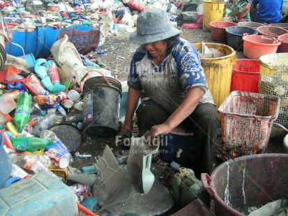 Fair Trade Photo Activity, Casual clothing, Child labour, Clothing, Colour image, Day, Family, Garbage, Garbage belt, Health, Horizontal, Hygiene, Multi-coloured, One woman, Outdoor, People, Peru, Recycle, Safety, Sanitation, Sitting, South America, Working