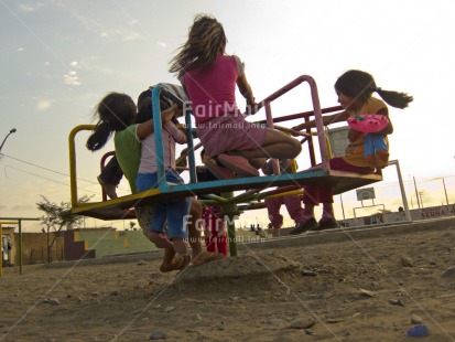 Fair Trade Photo 5 -10 years, Activity, Casual clothing, Clothing, Colour image, Emotions, Evening, Group of girls, Happiness, Horizontal, Latin, Looking away, Low angle view, Outdoor, People, Peru, Pink, Playground, Playing, Portrait fullbody, Smiling, South America