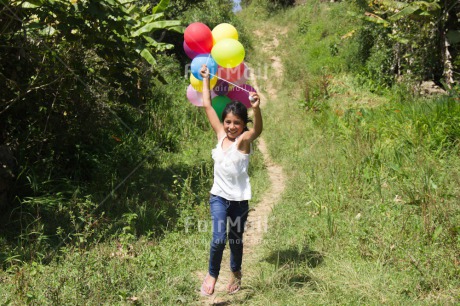 Fair Trade Photo Activity, Balloon, Birthday, Colour image, Day, Emotions, Green, Happiness, Horizontal, One girl, Outdoor, Party, People, Peru, Running, Rural, Smiling, South America