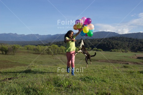 Fair Trade Photo Activity, Animals, Balloon, Birthday, Colour image, Day, Dog, Emotions, Friendship, Happiness, Horizontal, One girl, Outdoor, People, Peru, Playing, Rural, Smiling, South America