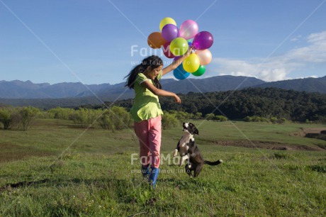 Fair Trade Photo Activity, Animals, Balloon, Birthday, Colour image, Day, Dog, Emotions, Friendship, Happiness, Horizontal, One girl, Outdoor, People, Peru, Playing, Rural, Smiling, South America