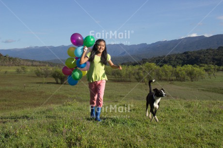 Fair Trade Photo Activity, Animals, Balloon, Birthday, Colour image, Day, Dog, Emotions, Friendship, Happiness, Horizontal, One girl, Outdoor, People, Peru, Playing, Rural, Smiling, South America